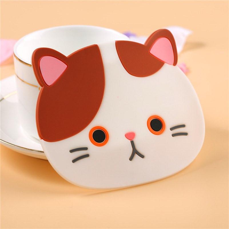 Cat Face Coaster leaning on Coffee Cup