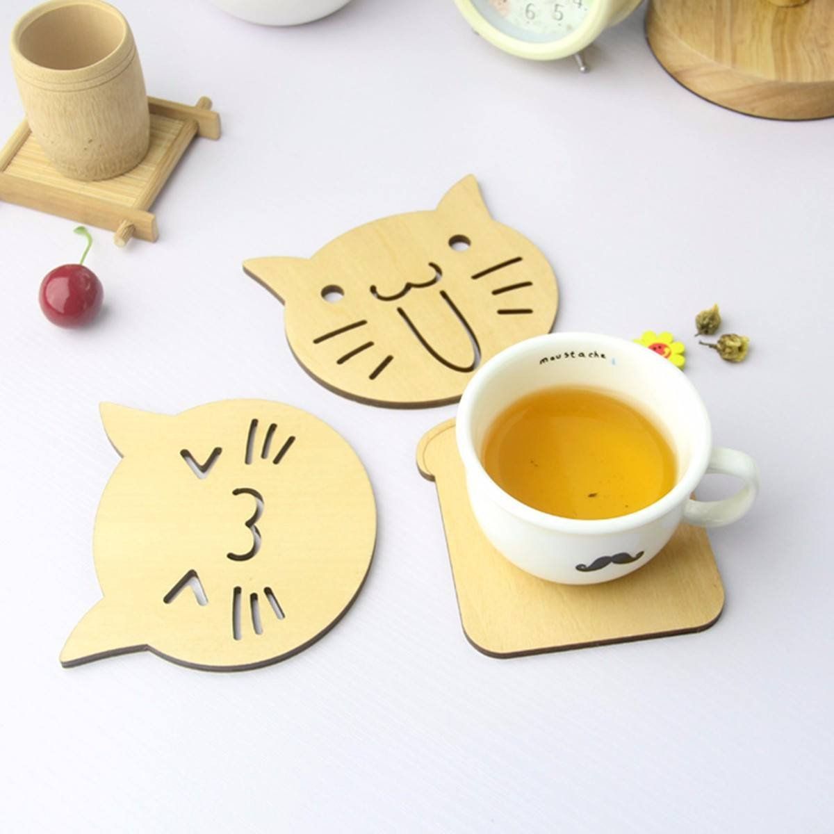 Happy and Surprised Wooden Cat Coasters on Table with Coffee