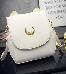 Front View of Cat Moon Leather Handbag - White on Desk