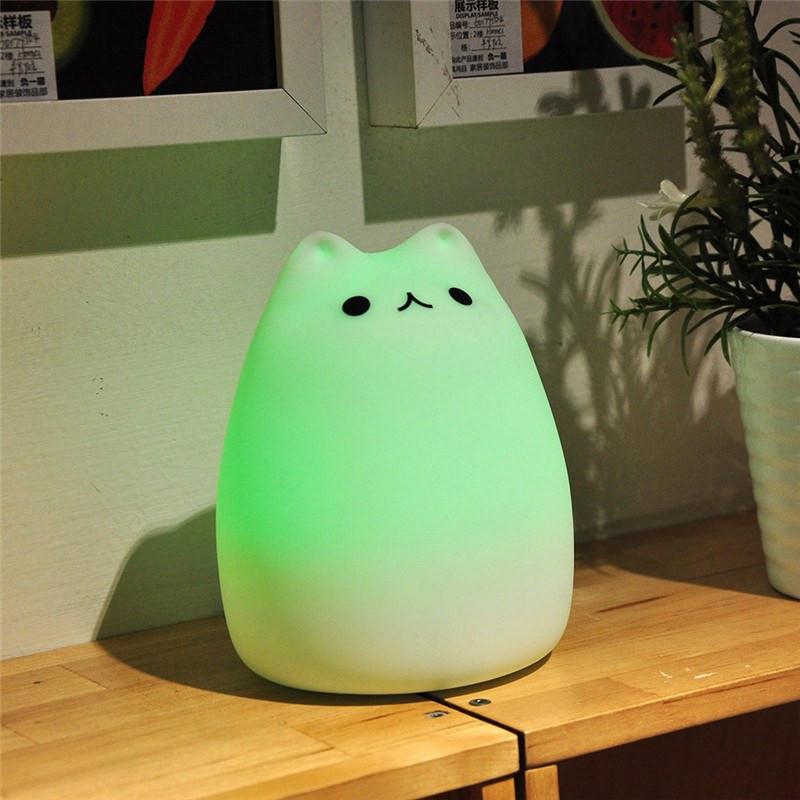 green night light cat on table
