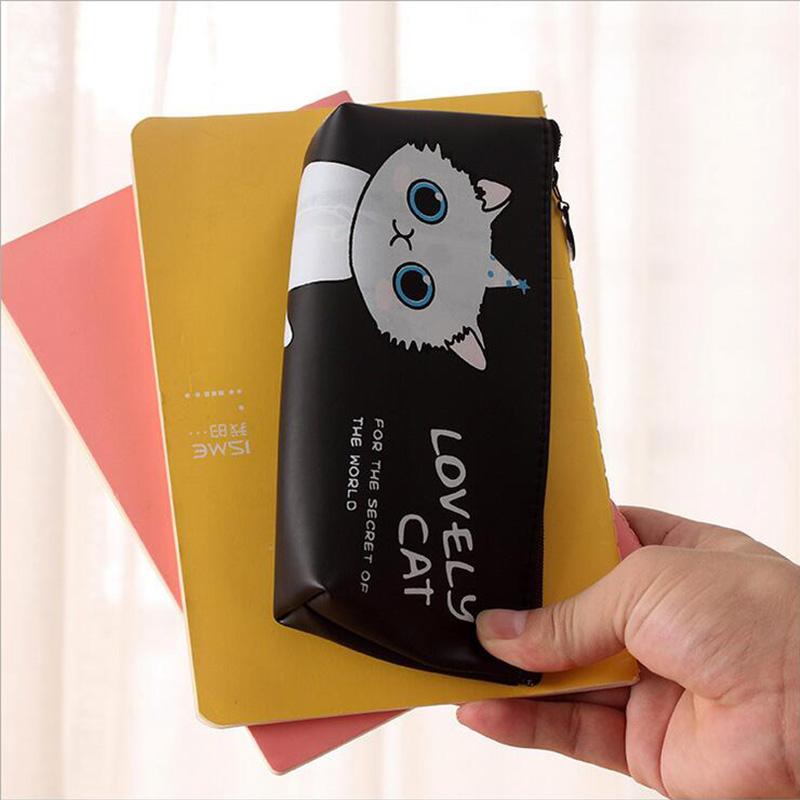 holding up cat pencil case and folder