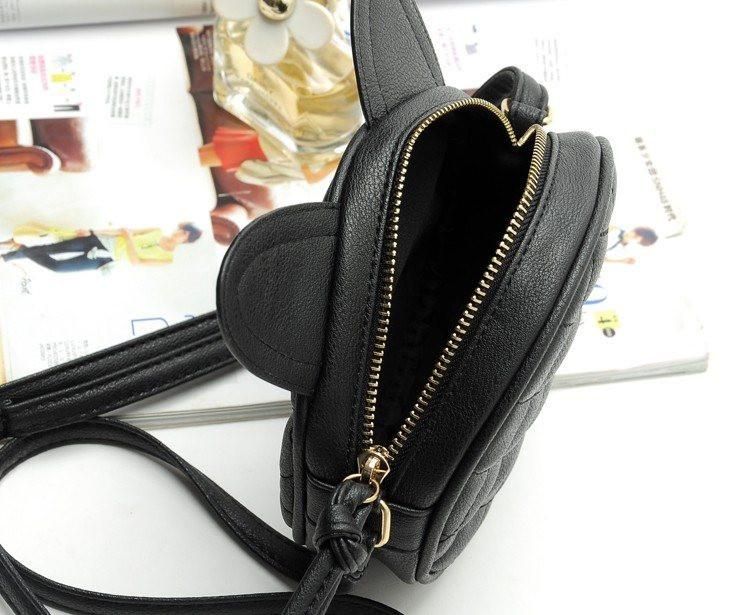 Opened Messenger Cat Ear Bag on Desk