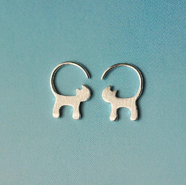 Long Tail Cat Earring on Blue Background